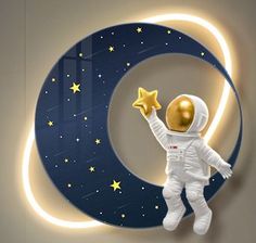 an astronaut floating in the air next to a crescent with stars and moon on it