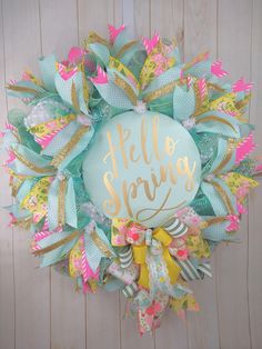 a wreath with the words hello spring on it