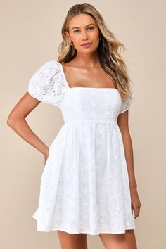 If we seem a little distracted, it's only because we were fantasizing about prancing through a meadow wearing the Lulus Fit to Frolic White Eyelet Lace Puff Sleeve Babydoll Dress! This embroidered eyelet lace dress is here to serve up all those free-spirited daydreams with its square neckline, short puffy sleeves (with elastic at the shoulders and cuffs), and babydoll silhouette. Mini hem wears well with bare feet and a basket of flowers! Hidden back zipper/clasp. Fit: This garment fits true to White Lace Dress With Short Sleeves, White Fancy Dresses, Homecoming Dress Modest, White Dress Aesthetic, White Dress Flowy, Puff Sleeve Babydoll Dress, White Babydoll Dress, Church Fits, Eyelet Lace Dress