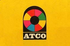 the logo for atco is shown on a yellow background