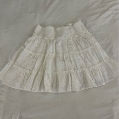 Super Cute Skirt For Summer And Spring! Never Worn And Has Tags!! Adjustable Waistband So Could Definitely Size Up! Casual White Tiered Skirt, White Tiered Mini Skirt With Elastic Waistband, Cute White Cotton Skirt, White Skirt With Elastic Waistband For Day Out, Cute White Skirted Bottoms, Cute White Mini Length Bottoms, Cute White Mini Bottoms, Cute White Beach Bottoms, White Cotton Casual Skirt