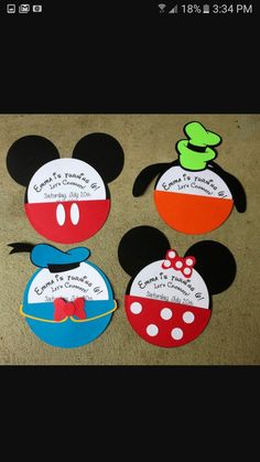 three mickey mouse magnets with the names of each character and their name on them