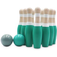 six green bowling pins and one gray ball are lined up in front of each other