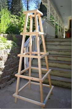 a wooden easel sitting on top of steps