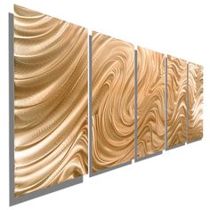 three panels are shown with gold and white swirls on the wall, one panel has an abstract design