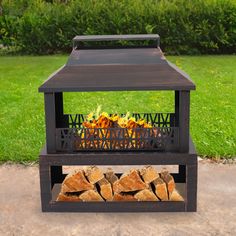 an outdoor fire pit with logs in it