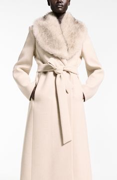 Add a pop of plush (or don't) with a wool-forward wrap coat that comes with a luxe faux fur collar you can add or subtract from the timeless silhouette. Open front Notched lapels Front welt pockets Lined 69% wool, 28% polyamide, 1% acrylic, 1% polyester, 1% cotton with 100% polyester faux fur contrast Dry clean Imported Coat With Fur Collar And Cuffs, Winter Coats 2024, Beige Winter Coat, Coat With Fur Collar, Women Winter Coat, Alpaca Coat, Faux Fur Collar Coat, Coat With Fur, Pastel Grey