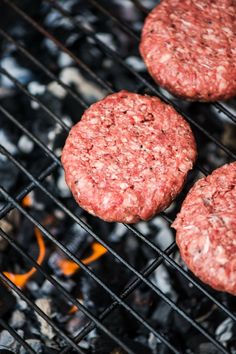 hamburgers cooking on the grill with text overlay that reads, must haves for grilling