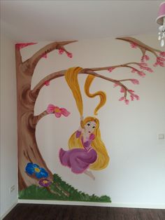 a room with a tree painted on the wall and a painting of a blonde haired girl