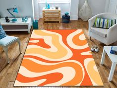 an orange and white area rug in a living room with two chairs, one chair and the floor is wooden