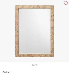 a wooden frame with flowers on it and a red heart in the middle, along with an image of a white square mirror