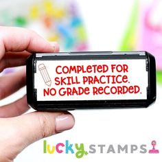 a hand holding up a cell phone with a sign on it that says, completed for skill practice no grade recorded