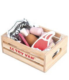 a wooden crate filled with toys on top of a white background