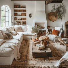 a living room filled with furniture and a fire place