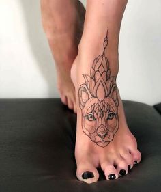 a woman's foot with a tattoo on it