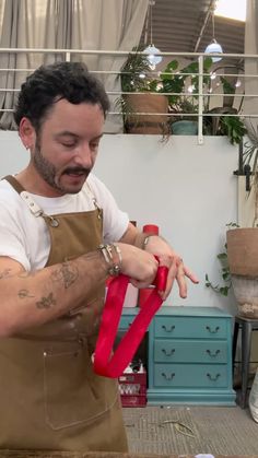 a man in an apron is making something