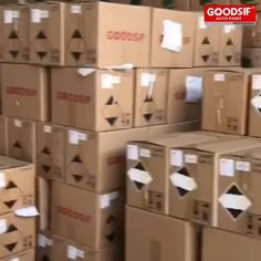 boxes stacked on top of each other with the words goods in red and white above them