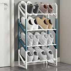 there is a rack with many pairs of shoes on it