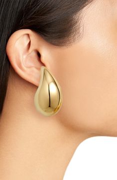 Add liquid shine to your lobes wearing these oversized teardrop-shaped earrings Italian-crafted from sterling silver plated in 18-karat gold. 1 1/4" length; 3/4" width Post back Sterling silver/18k-gold plate Made in Italy Nordstrom, Large Earrings, Drop Earring, Teardrop Earrings, Bottega Veneta, Silver Plate, Silver Plated, 18k Gold, Gold Plate