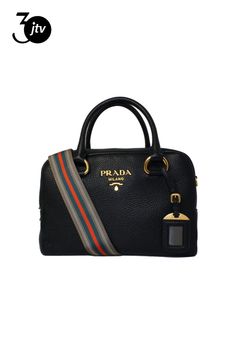 This classic Prada satchel bag is the perfect choice for an everyday look. The handbag is crafted with pebbled leather and features gold-tone hardware and the Prada logo on the front face. The two-way zipper opens to a black fabric interior with two interior pockets. The multi-colored web strap adds a unique yet elegant touch. Look no further for a luxurious wardrobe staple by Prada.    Model number: 1BB086  Color: Nero  Vitello Phenix calfskin leather  Gold-tone hardware  Two-way zipper fasteni Luxurious Wardrobe, Prada Logo, Crossbody Satchel, Satchel Bag, Black Fabric, Satchel Bags, Pebbled Leather, Everyday Look, Wardrobe Staples