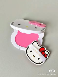 a hello kitty doll in a plastic container