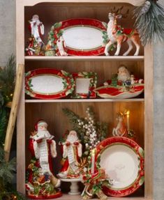 a china cabinet with christmas decorations on it