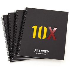 two black notebooks with the words 10x and planner written in red on them