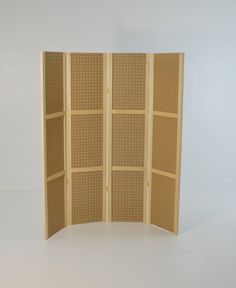 a room divider made out of wood with holes in the top and bottom half