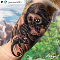 an arm tattoo with a monkey and a lizard on it