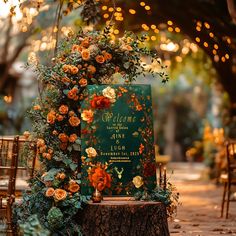 an outdoor ceremony set up with flowers and greenery