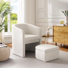 a white chair and ottoman in a room