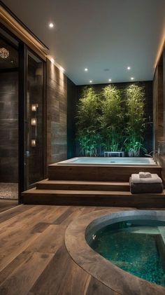 an indoor jacuzzi tub in the middle of a wood floored room with stairs leading up to it