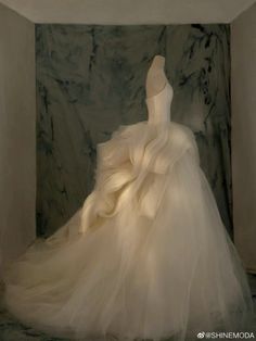 a white dress is sitting in a room