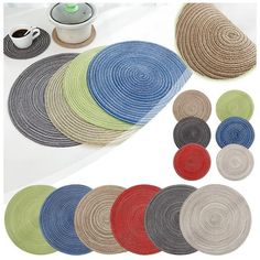 various colors of braided placemats on a white table with coffee cup and saucer