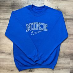 Mens Embroidered Blue Nike Sweatshirt Size Small All Sizes Available On My Page Fully Embroidered Super Soft And Comfortable Brand New Without Tags Measurements- Length 27 Inches Pit To Pit 23 Inches Message For Questions Vintage Nike Clothes Men, Vintage Nike Sweatshirt Men, Crew Neck Sweatshirt Outfit Men, Nike Vintage Crewneck, Nike Vintage Sweatshirt, Duke Sweatshirt, Sweatshirt Outfit Men, Crewneck Sweatshirt Outfit, Nike Aesthetic