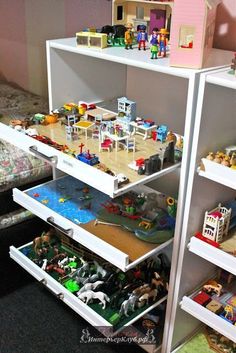 the shelves are filled with toys and other things to play with in their bedroom area