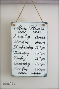 a sign hanging from the side of a wall that says there is no hours left