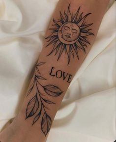 a sun and leaves tattoo on the arm