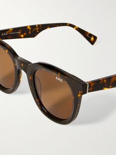 A.P.C.'s collaboration with Tame Impala explores Australian musician Kevin Parker's maximalist creative vision through the brand's minimalist lens. These sunglasses have been handmade in Japan from acetate with round frames and tonal lenses. Luxury Retro Sunglasses In Acetate, Summer Tortoiseshell Acetate Sunglasses, Luxury Acetate Shield Sunglasses, Luxury Retro Acetate Sunglasses, Kevin Parker, Sunglasses Tortoise Shell, Tortoiseshell Sunglasses, Tame Impala, Tortoise Shell Sunglasses