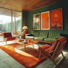 a living room filled with green furniture and orange rugs on top of a wooden floor