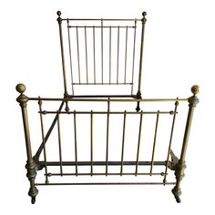 a metal bed frame with wooden posts