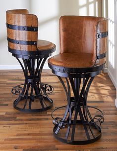 two wooden stools sitting next to each other on top of a hard wood floor