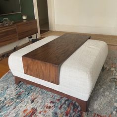 a living room with a large wooden tv stand