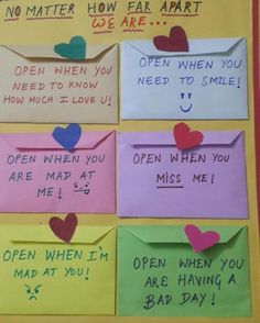 an assortment of different colored envelopes with hearts on them and words written on them