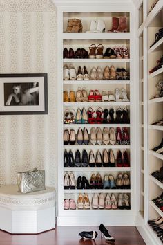 an organized closet with shoes and purses