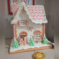 a gingerbread house is decorated for christmas