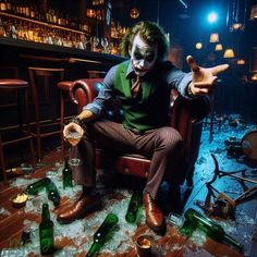 a man dressed as the joker sitting in a chair surrounded by bottles