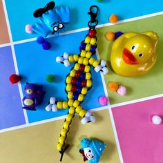 an assortment of toys and beads on a table