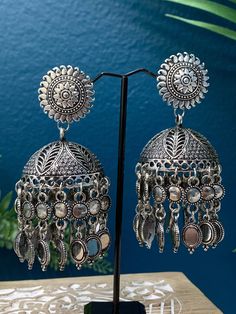 Light weight oversize earring. About 3 inch in length and two inch wide . Push back . Paper light weight . Silver Bohemian Style Drop Jhumkas, Silver Heavy Chandelier Earrings For Festivals, Heavy Silver Chandelier Earrings For Festivals, Silver Chandbali Plug Earrings, Silver Metal Dangle Jhumkas, Silver Earrings With Latkans For Festivals, Silver Dangle Jhumkas For Festival, Heavy Silver Dangle Earrings, Bohemian Silver Metal Jhumkas