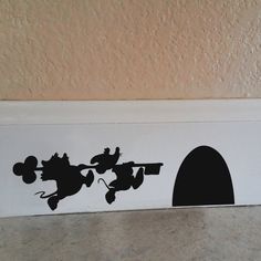 an image of a door with mickey mouse silhouettes on the front and back side